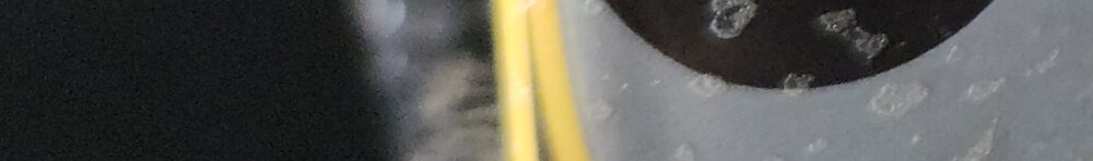 J B